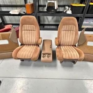 set of tan bucket seats with a center console and matching door panels, typically designed for 1988-1994 Chevrolet Silverado or GMC Sierra trucks.