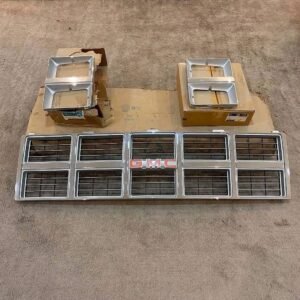GMC Front Grille Assembly with Dual Headlight Bezels (1985–1987)