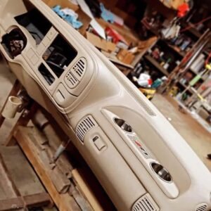 custom-wrapped dashboard designed for Chevrolet OBS trucks. It features premium upholstery with custom grill and cup holder inserts, priced at approximately $700.00.