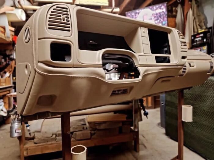 custom-wrapped dashboard designed for Chevrolet OBS trucks. It features premium upholstery with custom grill and cup holder inserts, priced at approximately $700.00. - Image 4